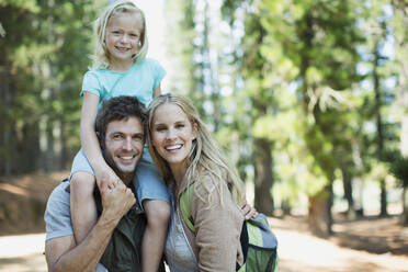 Smiling family in woods - CAIF28527