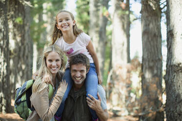 Smiling family in woods - CAIF28553