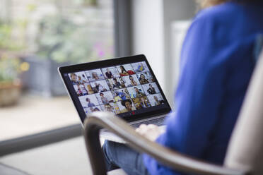 Colleagues video conferencing on laptop screen - CAIF28740