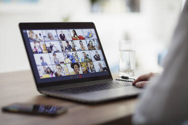 Colleagues video conferencing on laptop screen - CAIF28764