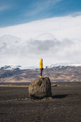 Man standing on rock - ADSF06397
