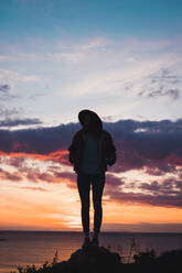 Woman in hat at evening sky - ADSF06516