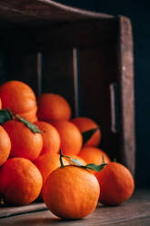 Fresh oranges in an old wooden box - ADSF06544