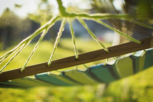 Close up hammock in sunny garden - CAIF28966