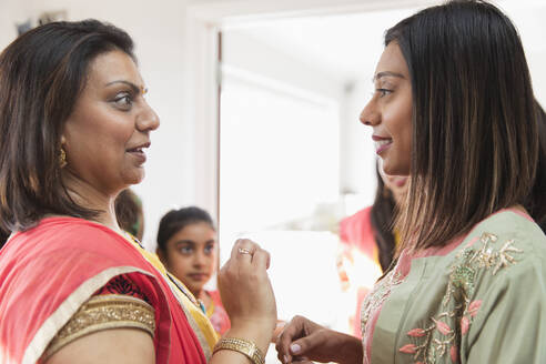 Indian women in saris talking - CAIF29001