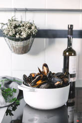 Pot with mussels on kitchen - ADSF06745