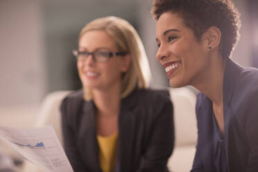 Smiling businesswoman in meeting - CAIF29316