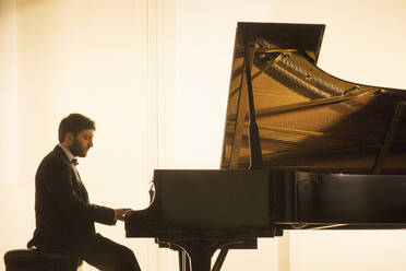 Silhouette of pianist performing - CAIF29383