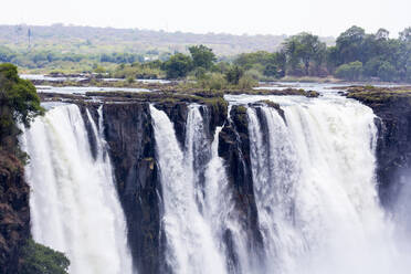 Victoria Falls, waterfall on the Zambezi River, cascades of water tumbling over a steep cliff. - MINF14886