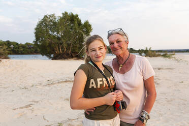 A senior woman and teenage girl, grandmother and her twelve year old grand daughter on vacation. - MINF14888