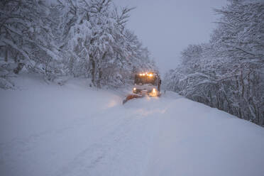 Snow blower working hard in high mountain - CAVF87498