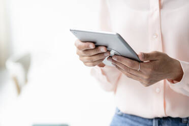 Close-up of businesswoman using tablet - KNSF08232