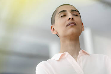 Portrait of woman with short hair and closed eyes - KNSF08276