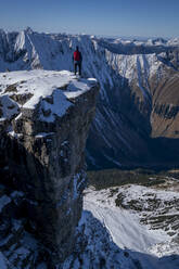 Male hiker standing at edge of Namloser Wetterspitze peak - MALF00026