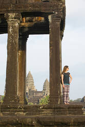 Female tourist gazing out at the Angkor archaeological complex, UNESCO World Heritage Site, Siem Reap, Cambodia, Indochina, Southeast Asia, Asia - RHPLF16898