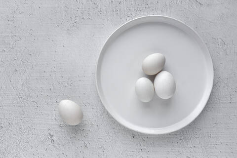 White eggs on wooden table stock photo