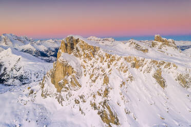 View by drone of pink sky at sunrise on Ra Gusela, Nuvolau, Averau, Marmolada covered with snow, Dolomites, Belluno, Veneto, Italy, Europe - RHPLF17053