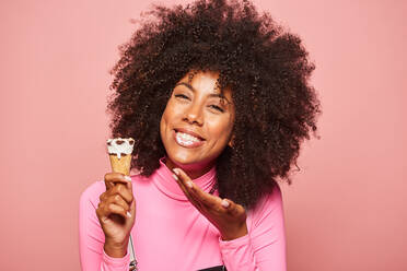Funny woman with ice cream on stick looking at camera - ADSF07799