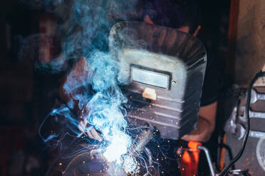 Professional welder in mask welding metal - ADSF08416