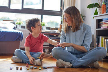 LOVING MOMENT OF HAPPY MOTHER PLAYING WITH HER CHILDREN. - CAVF87796