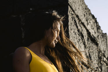 Portrait of beautiful latin woman in yellow swimwear - CAVF87902