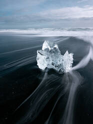 Huge block of ice on coast in Diamond beach Iceland - ADSF08843