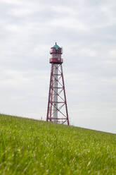 Germany, Lower Saxony, Campen, Campen Lighthouse in spring - WIF04300