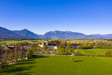 Germany, Bavaria, Benediktbeuern, Drone view of Benediktbeuern Abbey and surrounding village in summer - LHF00808