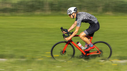 Man riding his racing bike - STSF02578