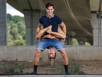 Young couple doing acrobatics - STSF02584