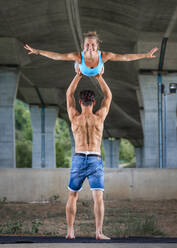 Young couple doing acrobatics - STSF02587