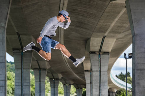 Young man doing acrobatics - STSF02589