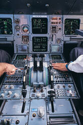 Pilots working in cockpit during flight - ADSF09169