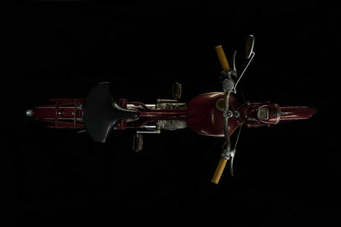 Top view of vintage motorcycle with black background (Miele K 50) - SRSF00658