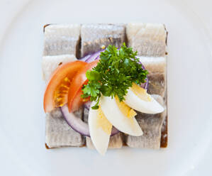 Close up of smorrebrod with herring at Icelandic restaurant - CAVF88046