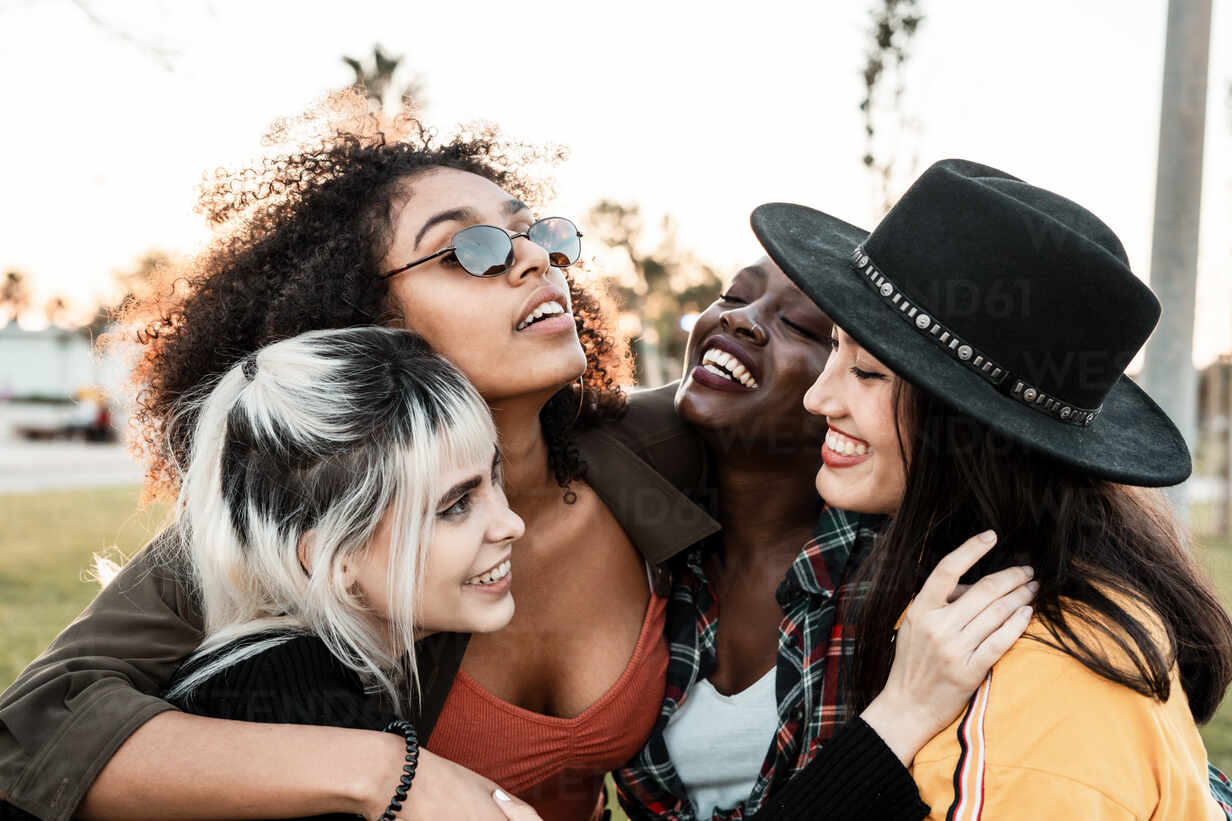 https://us.images.westend61.de/0001433893pw/group-portrait-of-diverse-young-women-wearing-clothes-in-hipster-style-looking-at-each-other-with-smiles-and-hugging-together-ADSF09384.jpg