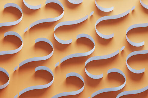 Three dimensional pattern of white question marks against orange background - DRBF00178