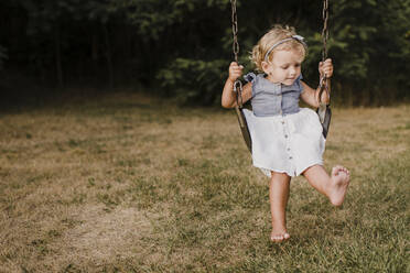 Cute little girl on a swing - SMSF00071