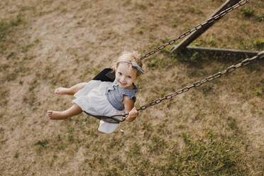 Cute little girl on a swing - SMSF00077