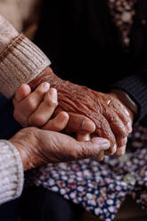 Detail of the wrinkled hands of an elderly couple - ADSF09532