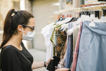 Woman with protective mask shopping - XLGF00444