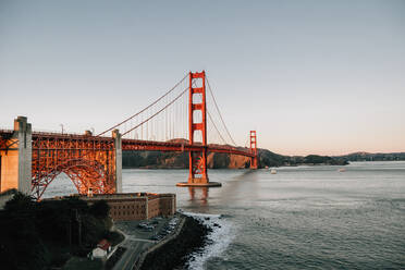 Golden Gate Bridge against clear blue sky in California landscape historical heritage in USA at sunrise - ADSF09985