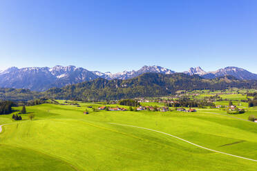 Germany, Bavaria, Drone view of clear sky over Tannheim Mountains and villages in Alpine foothills - SIEF09981