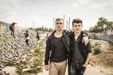 Portrait of cool teenage friends in an old run down industrial area - DHEF00219