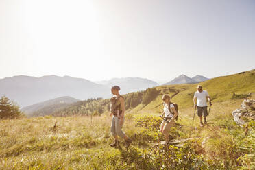 Three friends with baby hiking in the mountains, Achenkirch, Austria - DHEF00311