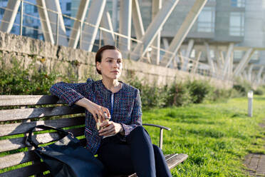 Beautiful manager in blue striped shirt enjoying hot beverage - ADSF10899