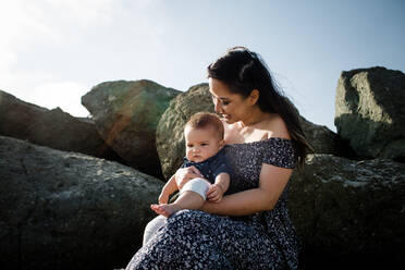 Vietnamese Mother Holding Mixed Race Infant Son - CAVF88096