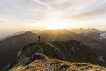 Female hiker during sunset, Saeuling, Bavaria, Germany - MALF00068