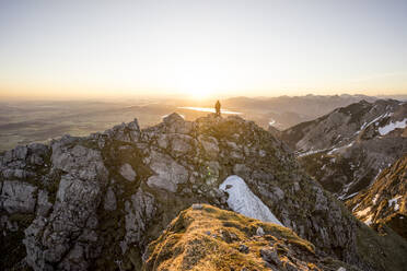 Hiker on viewpoint during sunset, Aggenstein, Bavaria, Germany - MALF00083