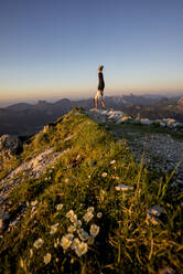 Man doing handstand on viewpoint, Gaishorn, Tyrol, Austria - MALF00089